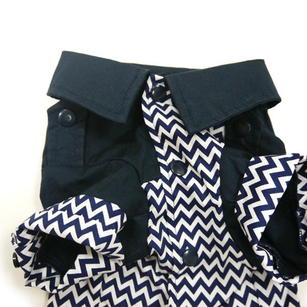 Close-up view of navy chevron dog shirt with snap buttons and folded front panels.