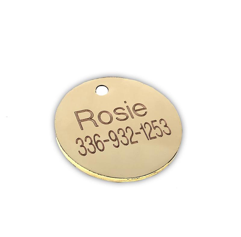 Round gold back dog tag engraved “ROSiE” and phone number 336-932-1253