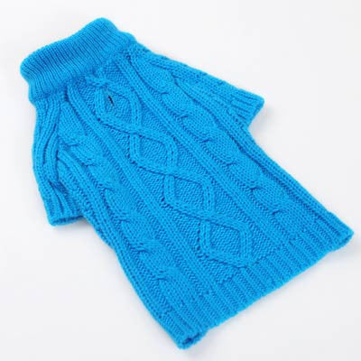 Blue cable-knit dog sweater, folded flat with braided cable pattern