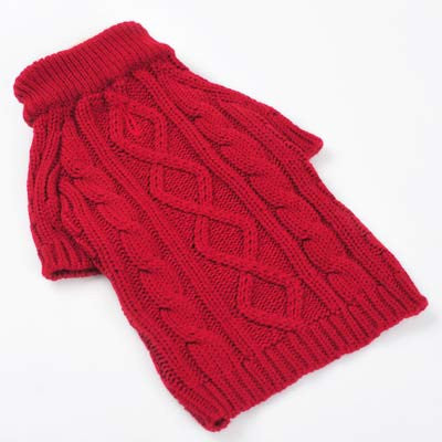 Red cable-knit dog sweater laid flat, ribbed cuffs and high collar
