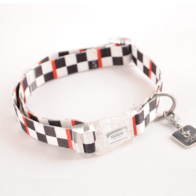 Checker-pattern dog collar in black and white with red accents; clear buckle and D-ring