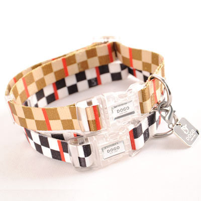 Checker-pattern dog collar with tan, black, and red accents; clear buckle and D-ring