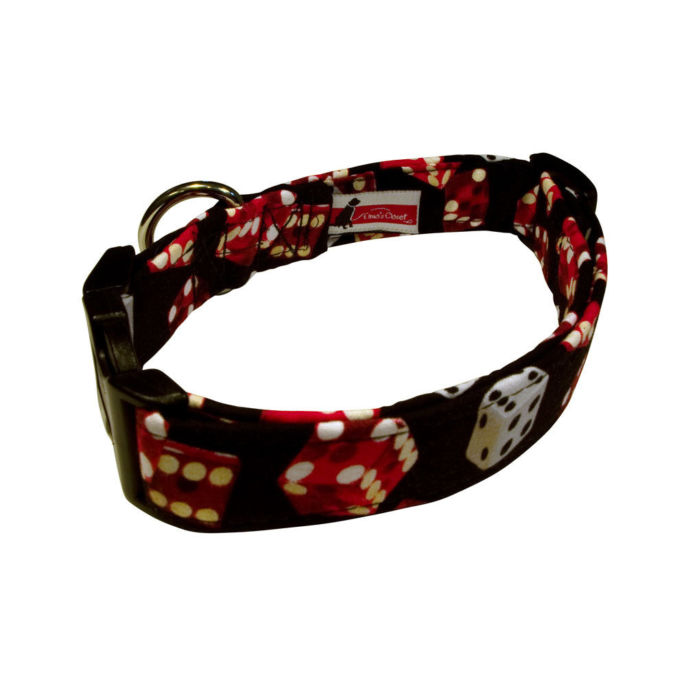 Black dog collar with red dice pattern and paw-print details, metal ring buckle