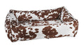 Durango urban lounger dog bed with brown-and-white cow-print fabric bolsters