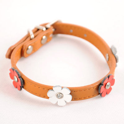 Brown dog collar with white and pink flower appliques and metal buckle ring