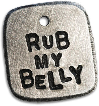 Silver hand-stamped dog tag reading 'RUB MY BELLY'