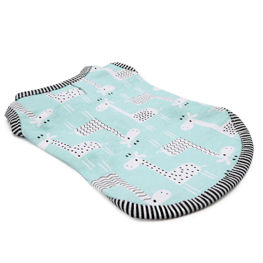 Teal dog tank top laid flat with giraffe pattern and black-and-white striped border.