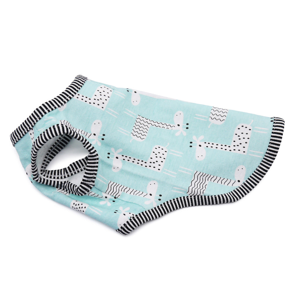 Teal sleeveless dog shirt with giraffe and animal print pattern and black-striped trim.