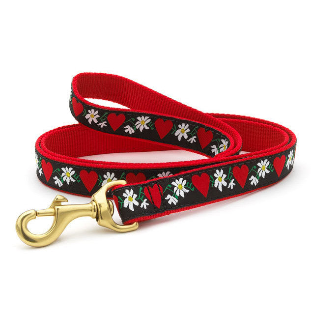 Red dog leash with black floral and heart pattern and brass metal clip