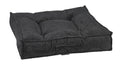 Dark gray chenille dog bed with cushioned, tufted bolsters and built-in base