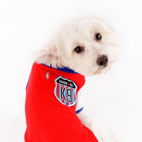 Red dog polo shirt with blue collar and K9 USA patch on chest