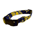 Dog collar with navy blue and yellow floral fabric, black buckle and D-ring
