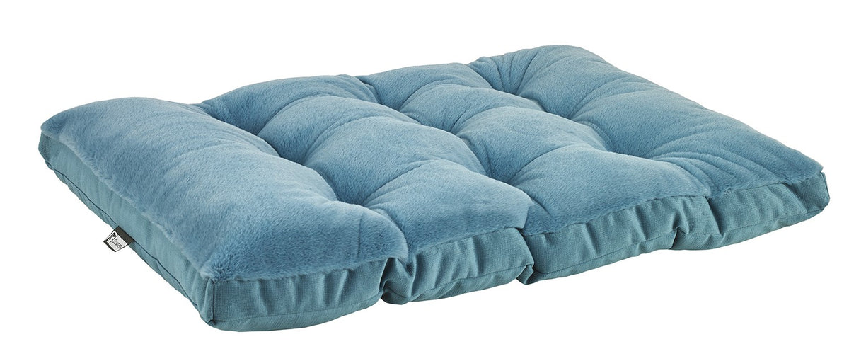Futon-style dog bed in blue with quilted tufted top and cushioned bolsters