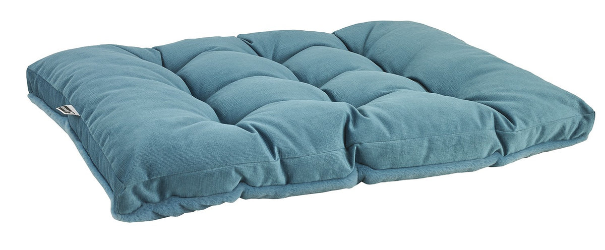 Blue futon-style dog bed with padded quilted panels and rolled edge bolsters