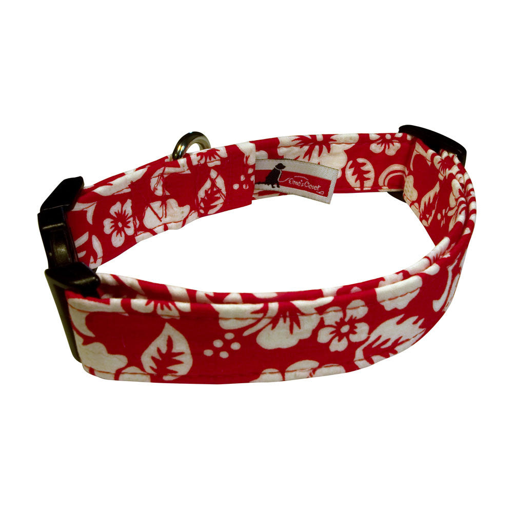 Red patterned dog collar with black buckle end and adjustable strap, metal D-ring