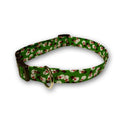 Green dog collar with mini snowman print, brown buckle and D-ring