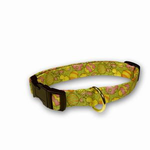 Green spring Easter eggs dog collar with black strap and metal D-ring, angled view
