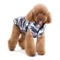 Camo dog sports coat with hoodie-style neck and black trim, camouflage print