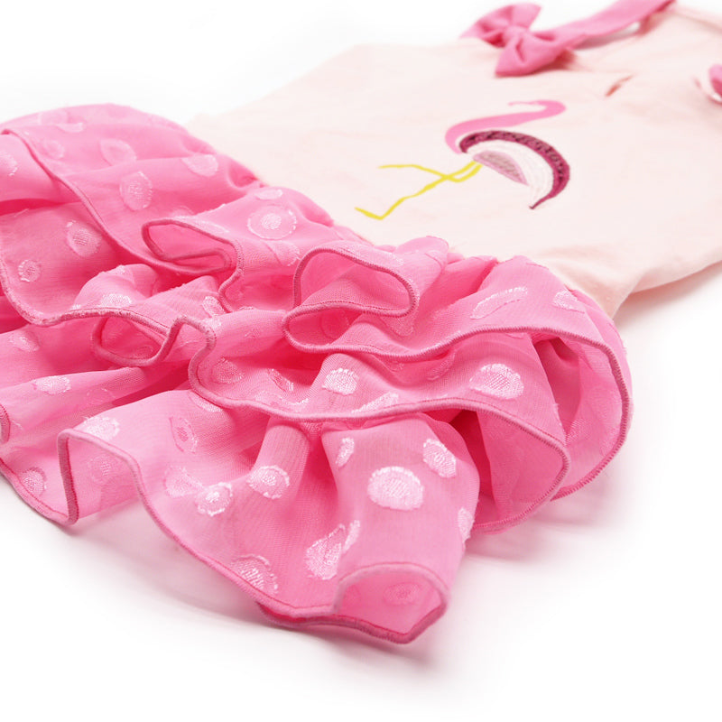 Pink layered tulle skirt with polka-dot texture and ruffled edges