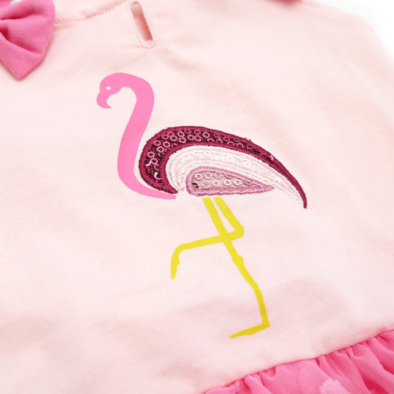 Light pink dog dress front with sequined flamingo applique and yellow beak