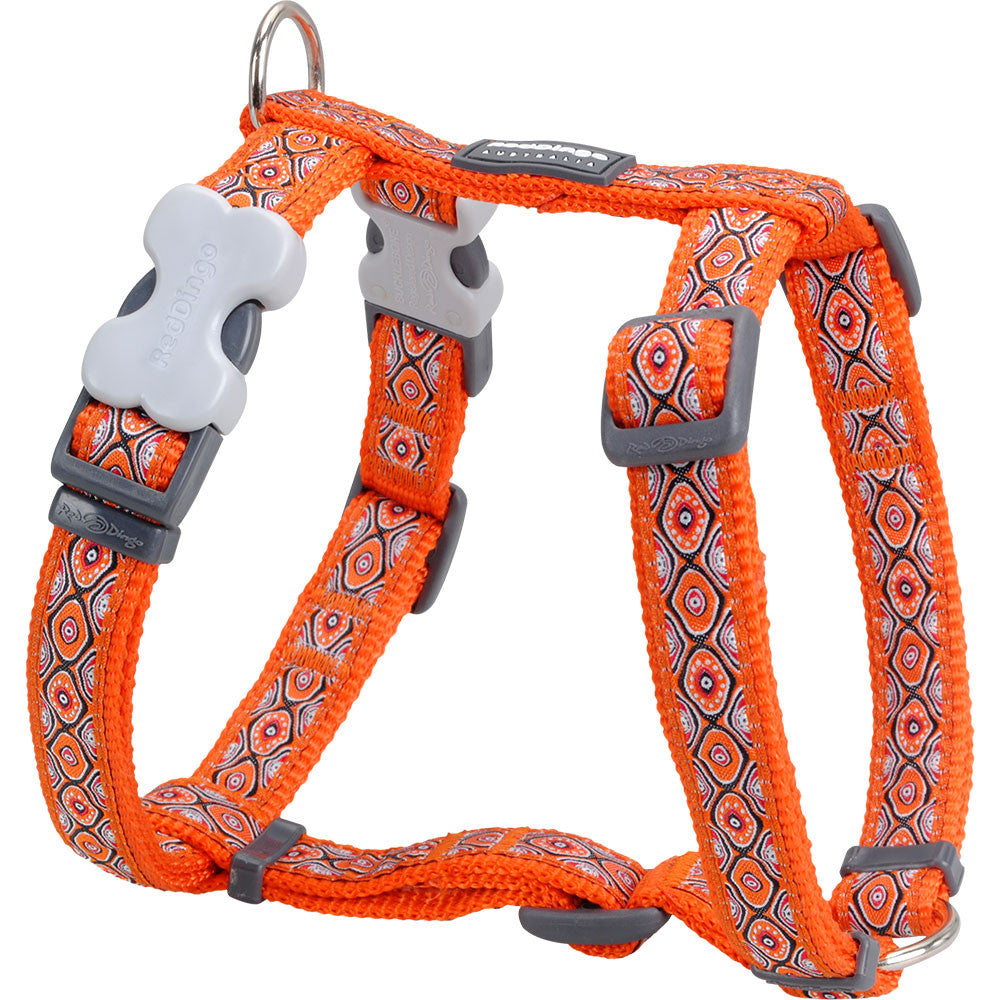 Orange patterned dog harness with gray buckles and chest strap