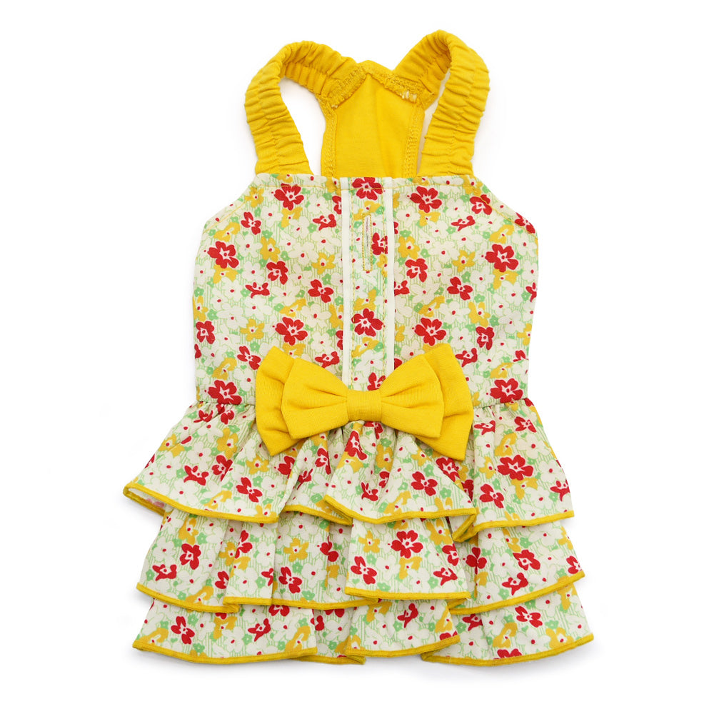 Floral dog dress with yellow ruffled sleeves, tiered skirt, and center bow