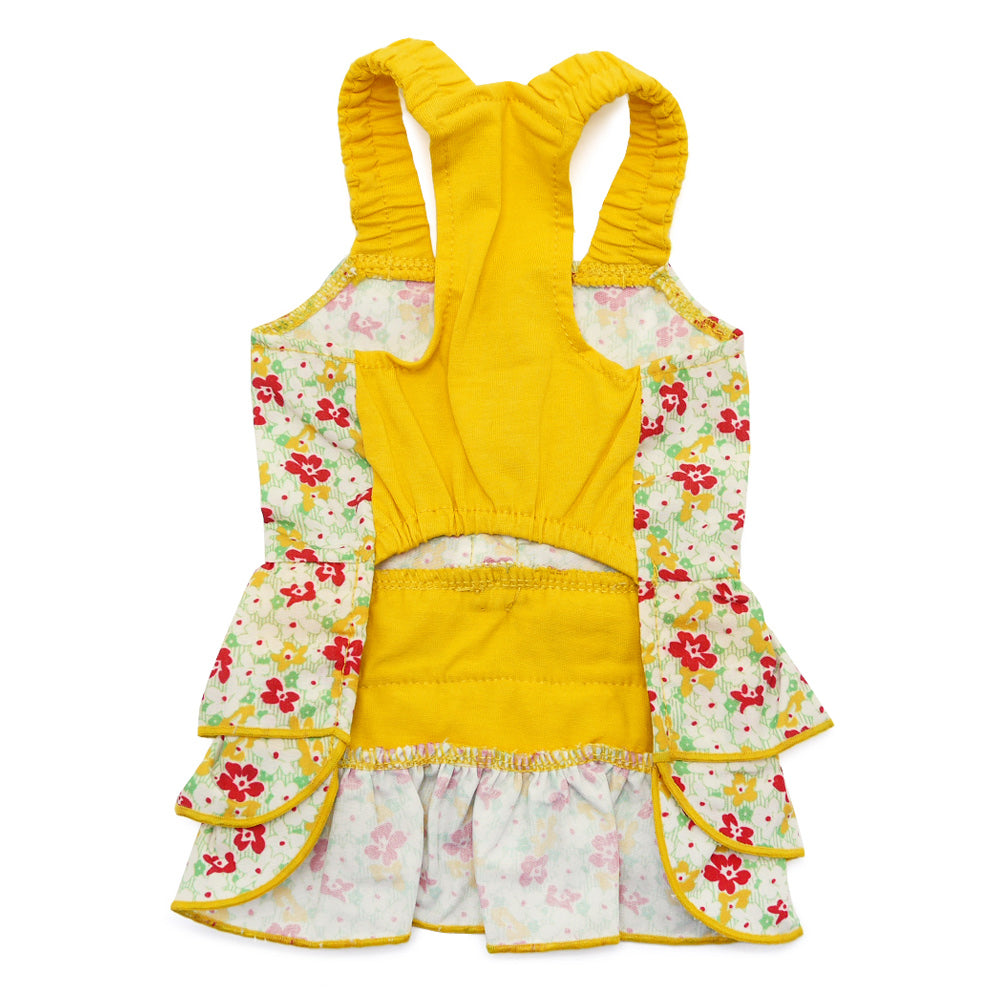 Back view of floral dog dress with yellow top, ruffled edges, and bow accent