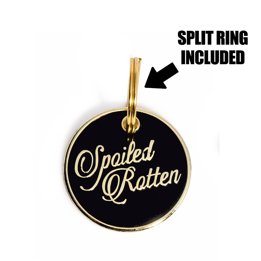 Round black “Spoiled Rotten” dog ID tag with split ring hardware attached