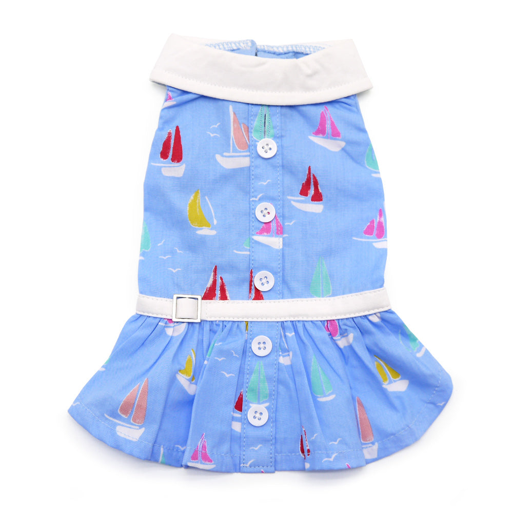 Blue dog dress with sailboat print, white neck trim, button placket and tiered skirt