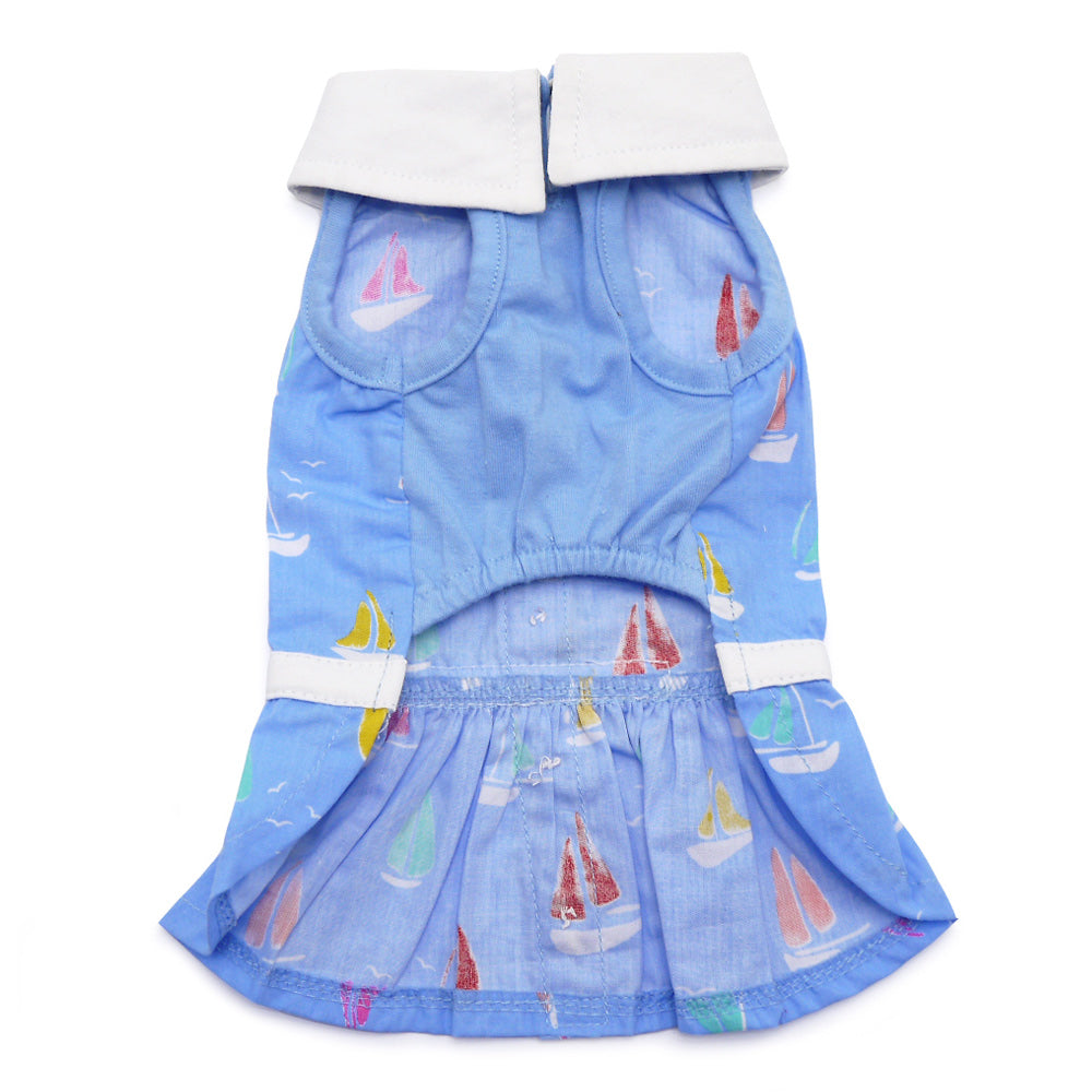Blue sailboat print dog dress with white waistband trim and tiered ruffle skirt
