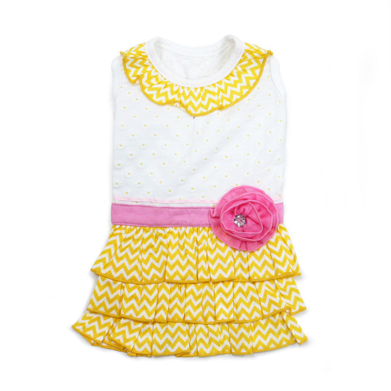 Dog dress on mannequin: white top, yellow chevron ruffled skirt, pink rose detail