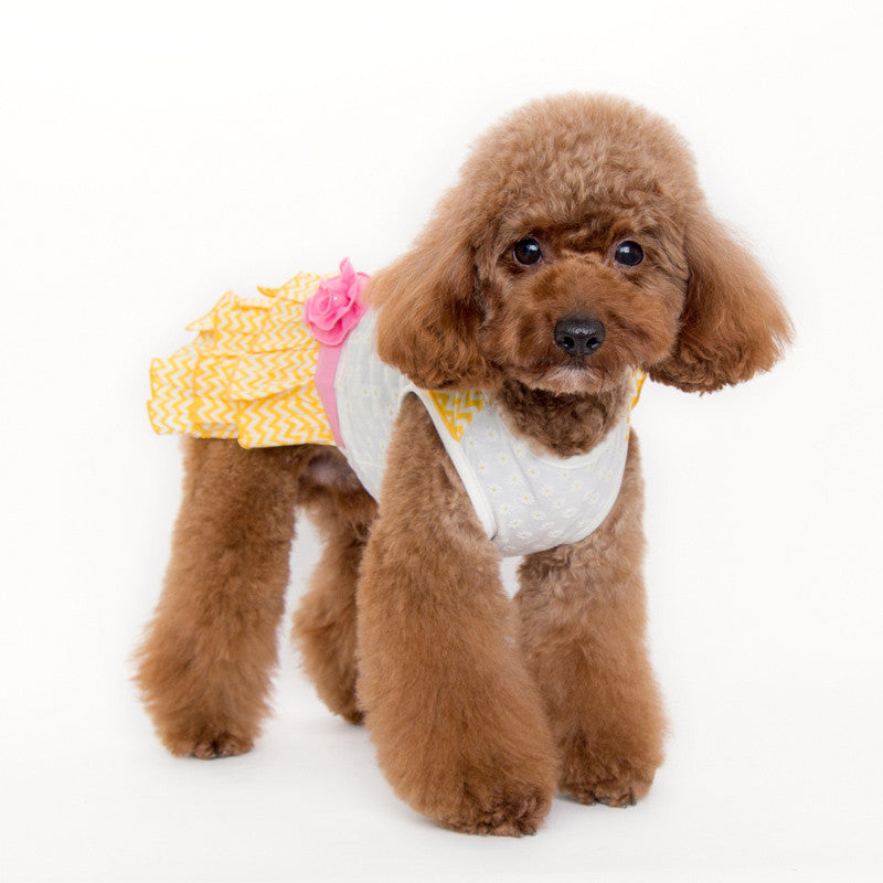 Front view dog dress: white dot top with pink trim and yellow chevron skirt