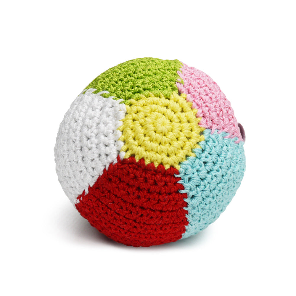 Crocheted dog ball toy with squeaker, white and red bottom with green, pink, yellow, blue