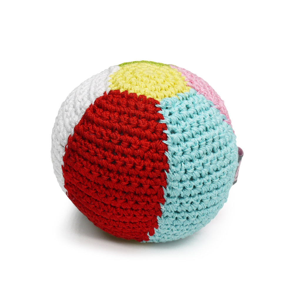 Crocheted dog ball toy with squeaker, red and light blue panel with yellow and pink top