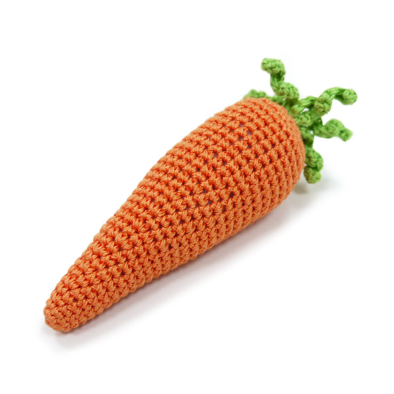 Crochet orange carrot dog toy angled view with green leafy top