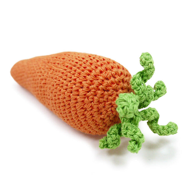 Crochet orange carrot dog toy with green tufted leaves