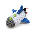 Crochet spaceship dog toy, white body with blue wings, green windows, black end with red strings