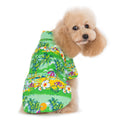 Green tropical island dog shirt with bright parrot, palm, and flower print