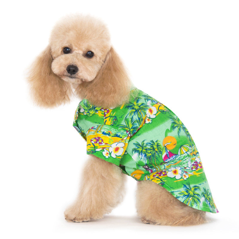 Green tropical island dog shirt with parrot, palm tree, and flower print; short sleeves