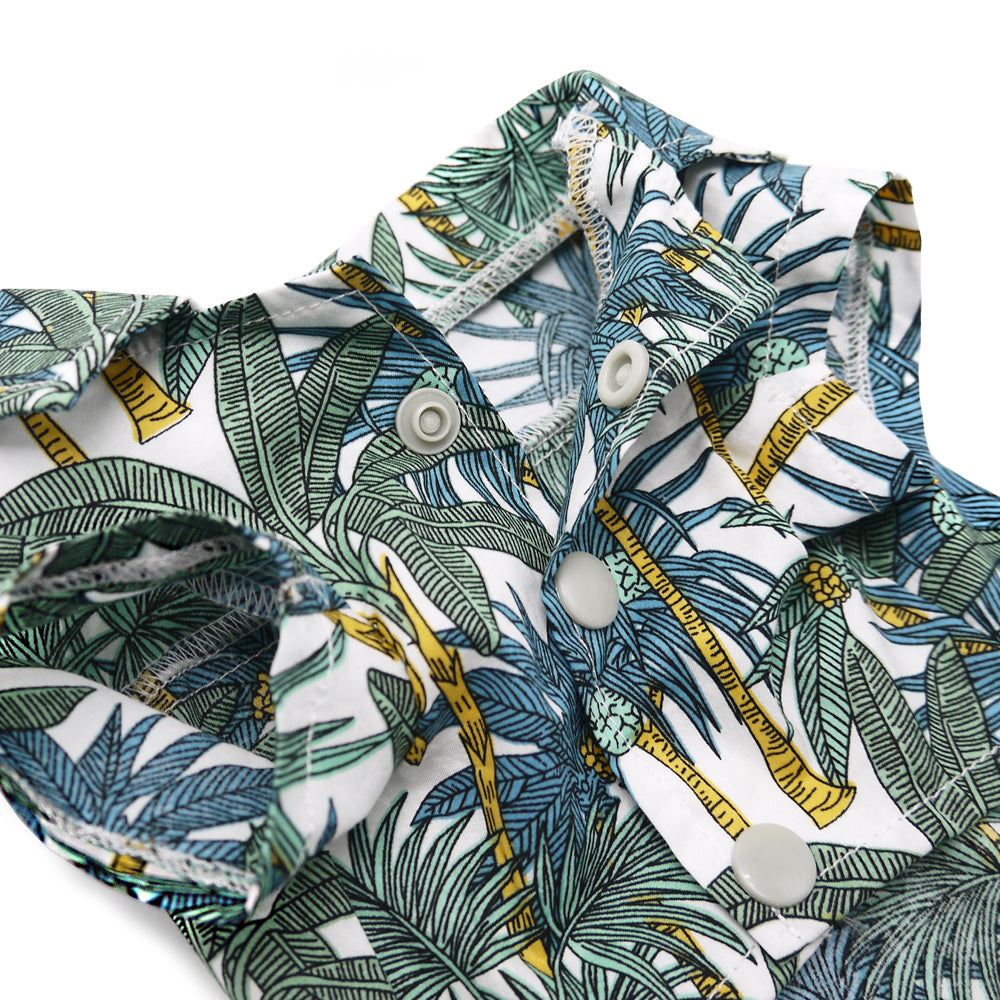 Close-up of tropical leaf dog shirt with yellow banana print and round snap buttons
