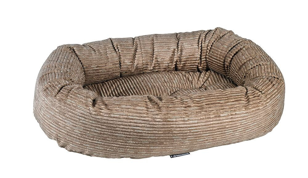 Wheat donut dog bed with ribbed beige-brown fabric and raised bolstered edge