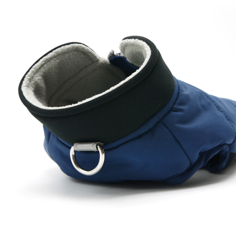 Blue dog coat with black high collar and gray fleece-lined hood opening.