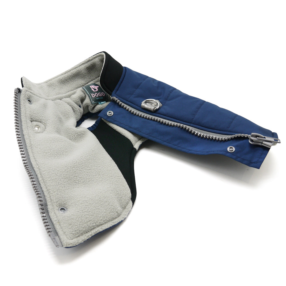 Blue dog coat laid open with gray fleece lining and front zipper panel visible.