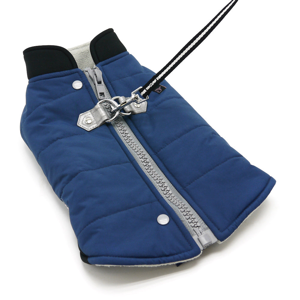Blue dog coat close-up showing front zipper, D-ring leash clip, and snap button.