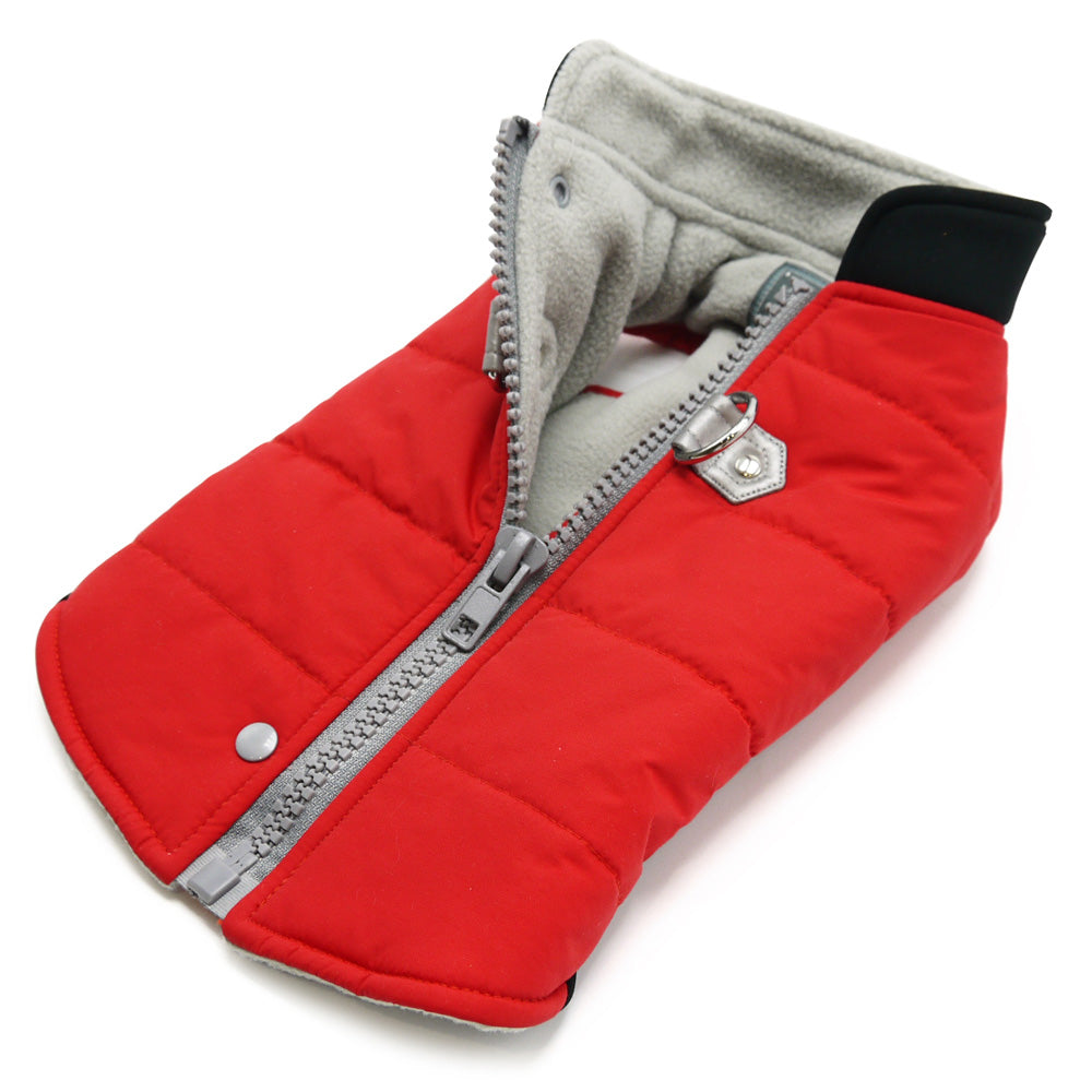 Red padded dog coat with gray fleece lining and front zipper, angled close-up