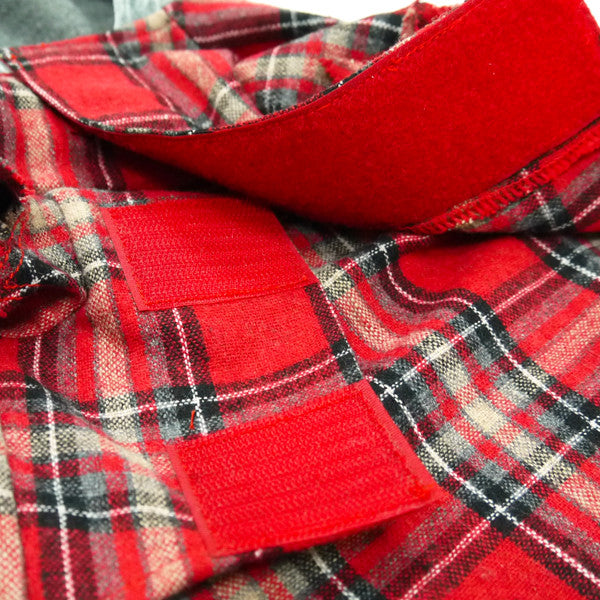 Red plaid dog costume with plush red panel detail and stitched fabric texture.