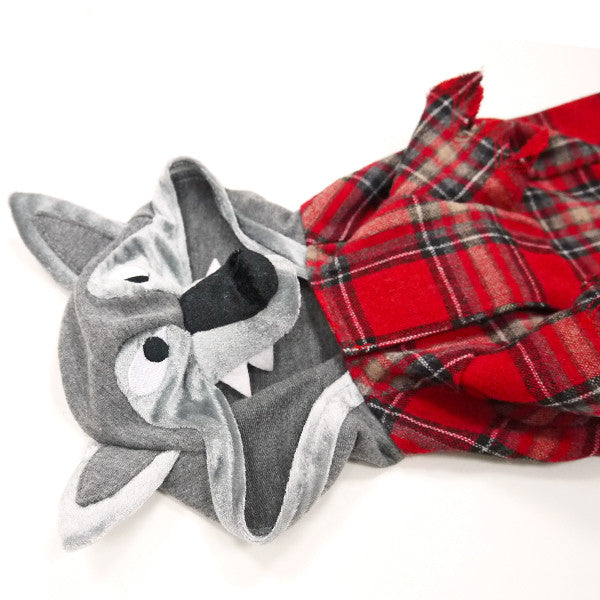 Gray wolf face plush hood with black nose and red plaid dog costume body.