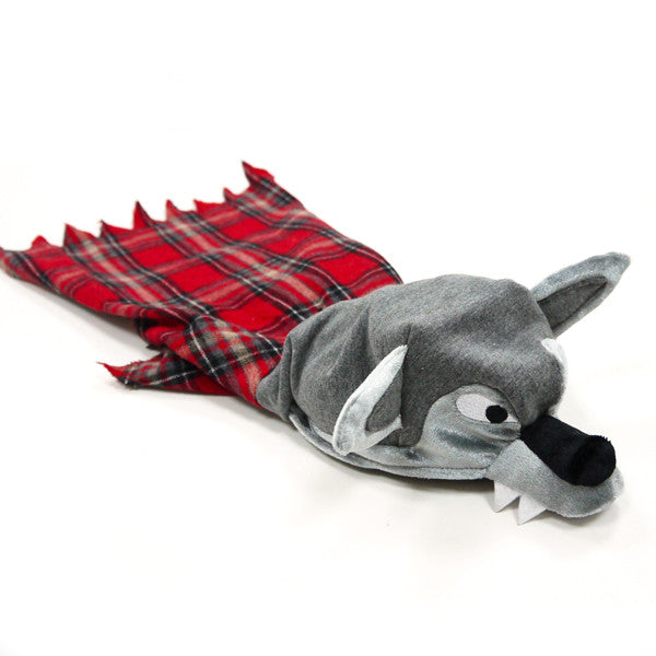 Gray wolf plush hood with pointed ears on red plaid dog costume, laid flat.